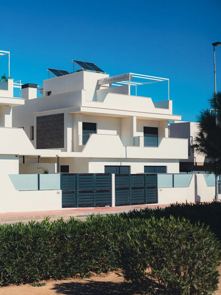 A contemporary villa terrace above the Bay of Beaulieu at dusk.